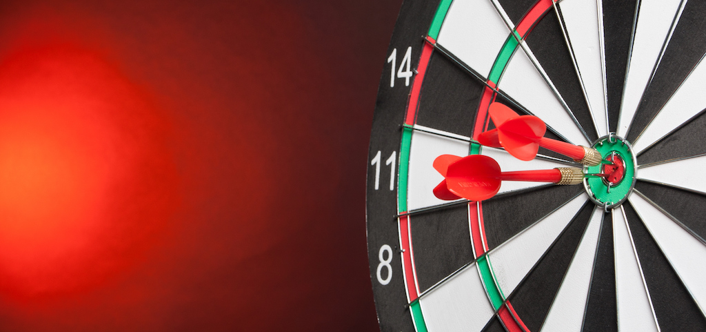 Two Darts in the center of the target dartboard